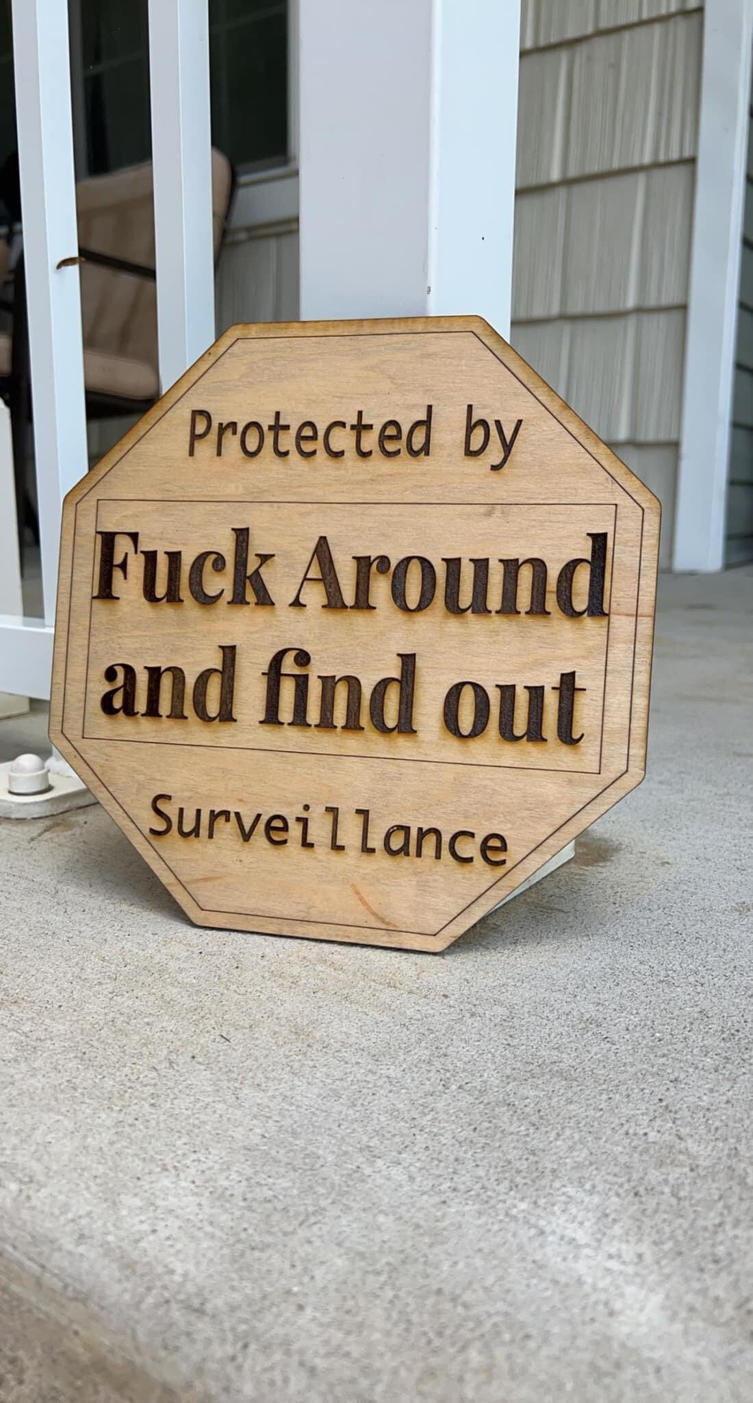 Protected by Fuck around and find out surveillance sign