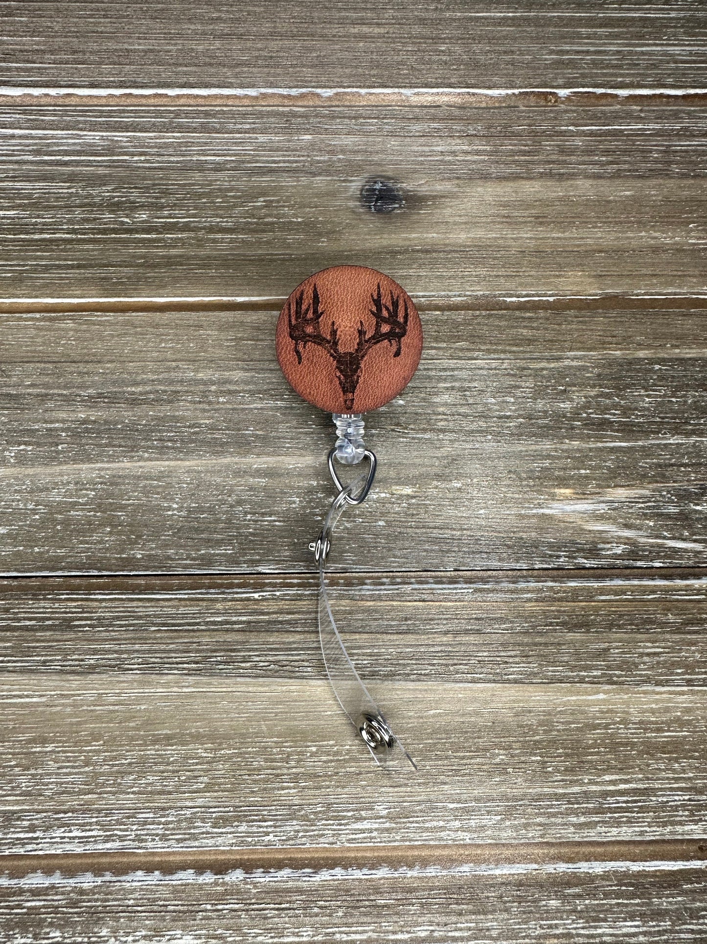 Leather Engraved Deer skull badge reel on veg tanned leather